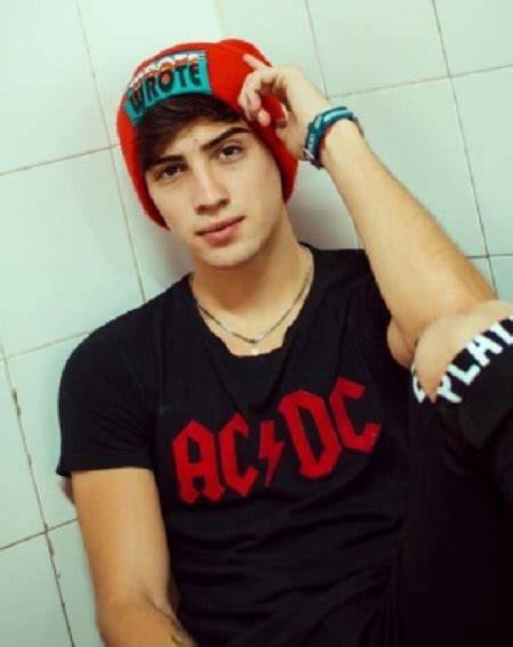 Augusto Gimenez wearing the merch of ACDC