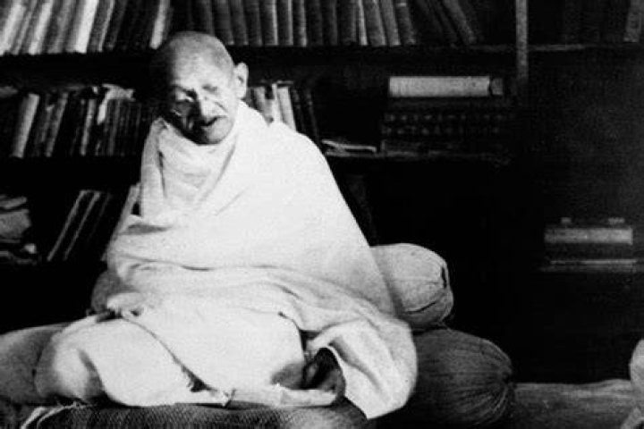 Gandhi Sitting On A Cushion