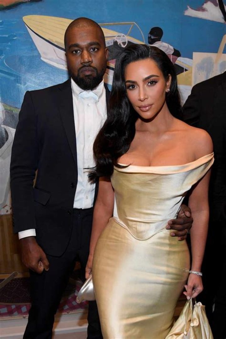 Kanye West posing with Kim Kardashian in 2007