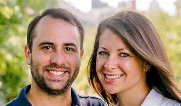 Melissa DeRosa with husband Matthew Wing in a red dress