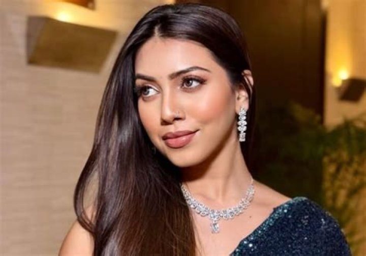 Simran Khan taking a filtered selfie with her iPhone 12