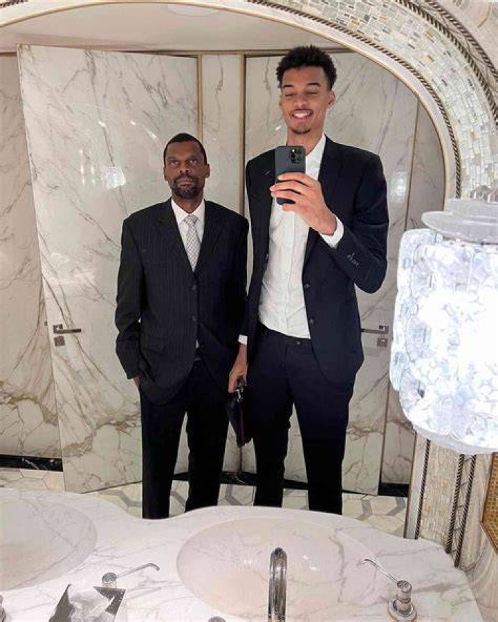 Victor Wembanyama with his dad